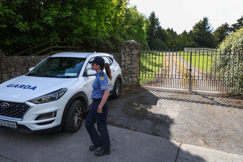 Gardaí at a site in Rathfarnham, where they began a search relating to the murder of Liam Murray. Photo: Colin Keegan/Collins